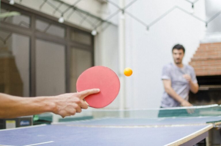 Closeup to a sportsman's hand playing table tennis
